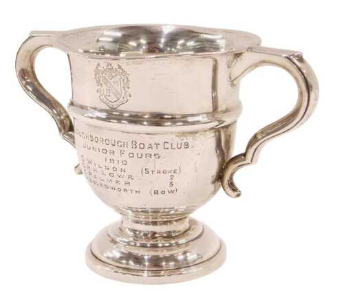An Edward VII two handled trophy, with acanthus leaf ear handles, egg shaped body, inverted stem...