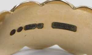 A 9ct gold patterned wedding band, of bar, dot and cross design, maker MS&S, London 1971, ring... - 2