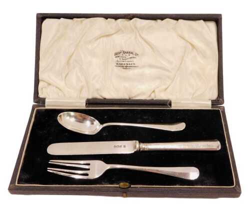 A Harlequin George V silver and other three piece christening set, comprising fork, rattail...