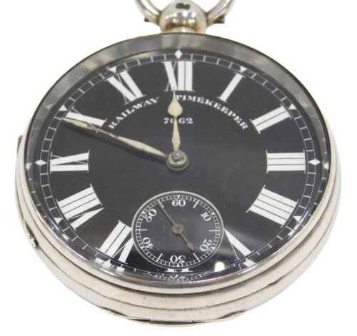 A Victorian silver cased railway timekeeper open faced pocket watch, the 6cm diameter Roman...