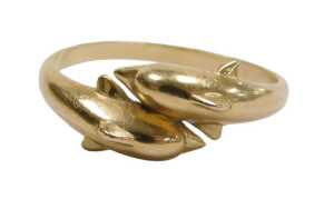 A dolphin dress ring, with two arched dolphins in crossover design, yellow metal stamped 14k,...