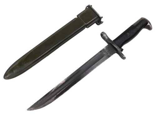 A WWII American style Garand type bayonet, with shaped blade marked UC-MOD, with turned grip and...