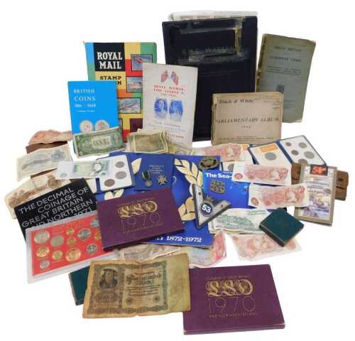 Various banknotes, commemorative coins, medals, etc., brass cap badge centred with crown, 6cm...