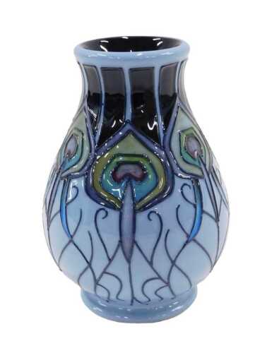A Moorcroft pottery Peacock Parade pattern vase, of bulbous form on circular foot, 10cm high.