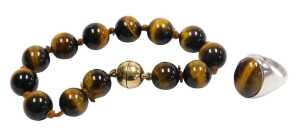 Two items of tiger's eye jewellery, comprising a moulded bead bracelet, with silver gilt clasp...