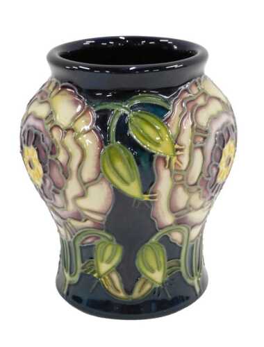 A Moorcroft Connoisseur collection pottery vase, probably Gustavia pattern, 10cm high, boxed.