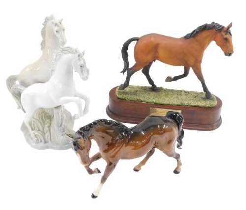 A Beswick pottery horse, front leg raised, 18cm high, a further Forest-Foreman fold 1979 horse,...