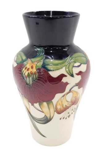 A Moorcroft pottery Hanna Lily vase, of circular form, 31cm high.