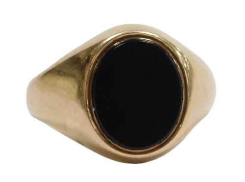 A 9ct gold signet ring, set with stone in rub over setting, with import marks, ring size Q&frac12;,...