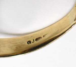 A 9ct gold signet ring, set with stone in rub over setting, with import marks, ring size Q&frac12;,... - 2