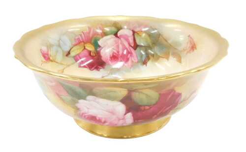 A Royal Worcester bowl, with gilt fluted border, painted rose decoration bearing signature...