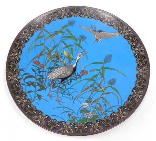 A 19thC Japanese Meiji period cloisonne enamel dish, of circular form, decorated with exotic...