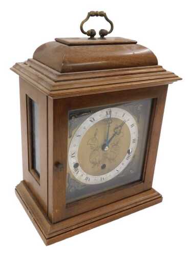 A 20thC oak cased Elliott chiming mantel clock, with 15cm square back plate, with raised...