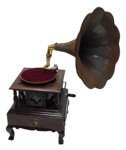 A HMV table top gramophone, with metal horn, articulated chrome needle, and 25cm diameter red...