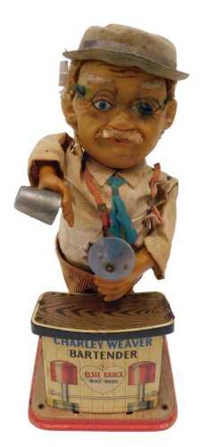A Japanese part tinplate articulated Charlie Weaver the Bar Tender figure group, 37cm high.