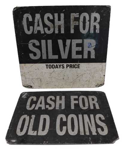 An advertising sign Cash for Old Coins, in silver lettering, on an oblong black board ground,...