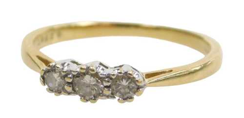 A diamond three stone dress ring, set with three round brilliant cut diamonds, totalling...