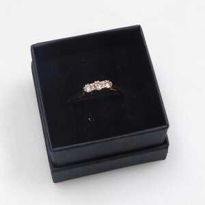 A diamond three stone dress ring, set with three round brilliant cut diamonds, totalling... - 4
