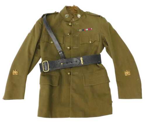 A vintage British Army Warrant Officer's service dress tunic, circa 1930s, with various brass...