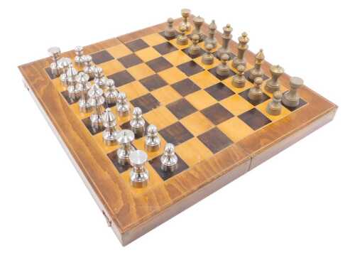 A heavy 20thC brass centred chess set, with silver and multicoloured pieces, with chess and...