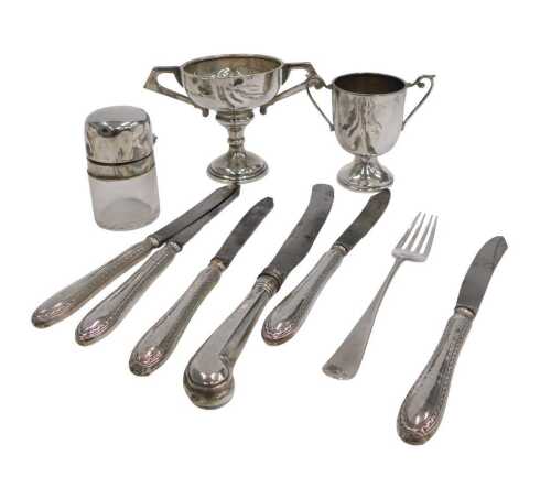 A George V silver trophy, with plain bowl flanked by angular handles, on inverted stem and...