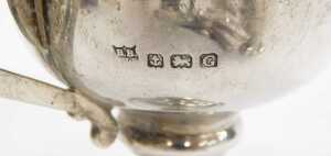 A George V silver trophy, with plain bowl flanked by angular handles, on inverted stem and... - 2