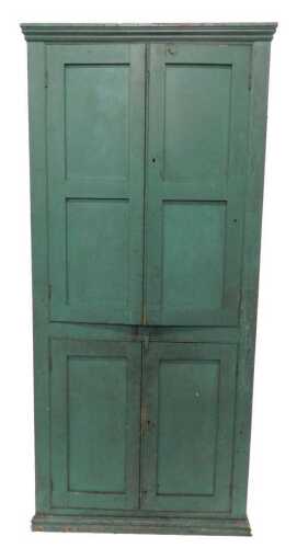 A Victorian pine kitchen cupboard, of rectangular form with fixed cornice, raised above a pair...