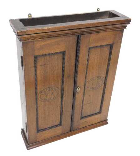 A 19thC oak hanging cigar cabinet, with a beaded outline to the two panelled doors, stamped...