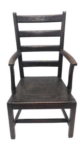 A principally 19thC heavily carved ladderback armchair, decorated with scrolls and birds, with...