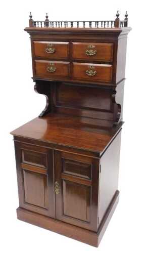 An Edwardian narrow cabinet, the galleried top surmounted by urn finials, raised above four...