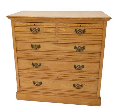 An Edwardian oak chest, of two short and three long drawers, each with later swan neck handles,...