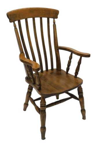 A 19thC style oak lath back chair, with comb top, shaped vertical splats, scroll arms, and...