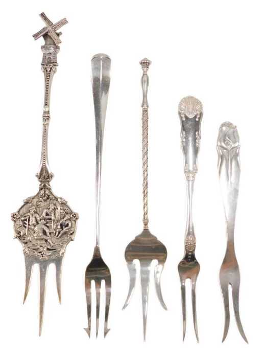 Various early 20thC pickle and serving forks, to include a Dutch example, with articulated...