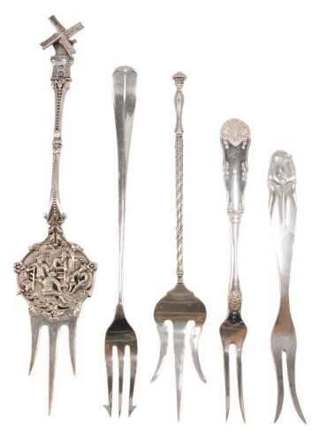 Various early 20thC pickle and serving forks, to include a Dutch example, with articulated...