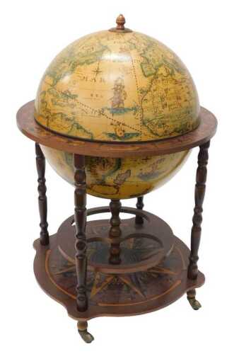 A late 20thC retro globe decanter, the hinged lid revealing space for bottles and glasses, on...