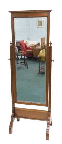An early 20thC mahogany framed cheval mirror, the rectangular bevelled glass flanked by plain...