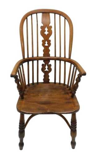 A 19thC Nottinghamshire high back ash and elm Windsor chair, with Christmas tree splat, shaped...