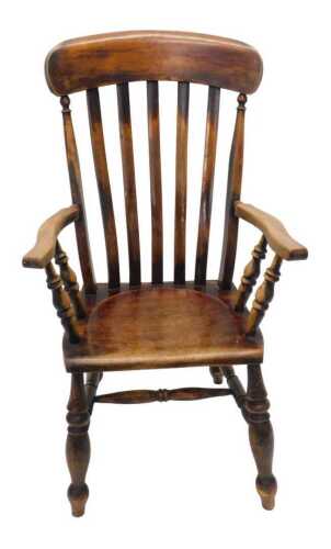 A 19thC ash and elm lath back Grandmother chair, with turned supports, shaped seat, single ring turned front legs joined by a horizontal stretcher, possibly Lincolnshire but unmarked, 105cm high.