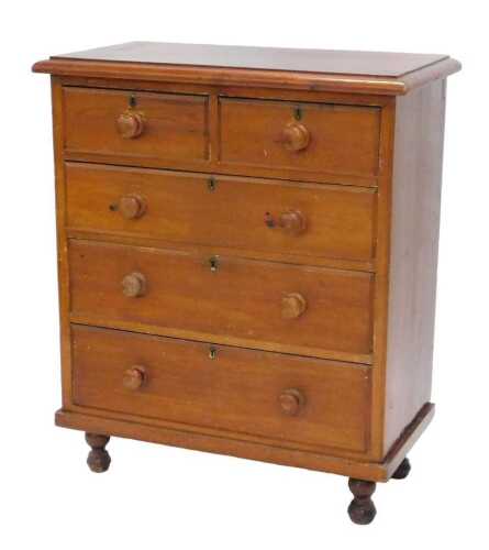 An early 20thC narrow pine chest, of two short and three long drawers, with knob handles, on turned bun feet, 109cm high, 93cm wide, 47cm deep.