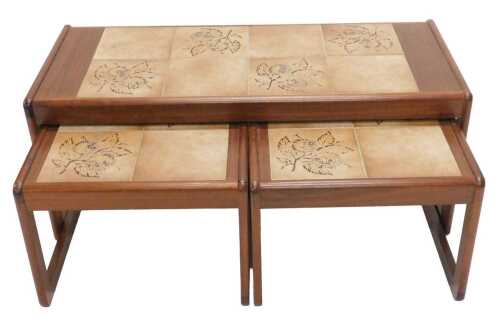 A Sunelm retro teak coffee table set, comprising tile top rectangular coffee table, on shaped...