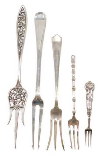 Various early 20thC pickle forks, one with a pierced entwined and floral leaf handle and three...