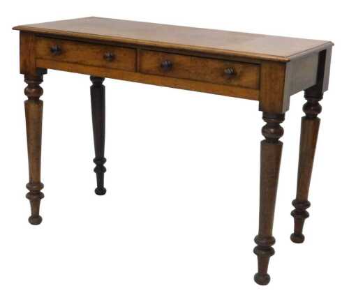 A Victorian mahogany side table, of rectangular form, with two frieze drawers, each with knob...