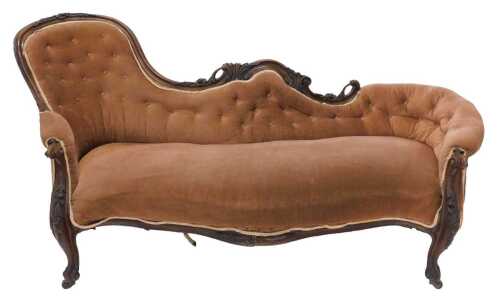 A Victorian carved mahogany chaise longue, with serpentine back and seat, overstuffed in button...