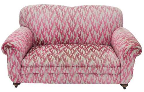 An Edwardian mahogany framed two seater drop arm sofa, upholstered in later pink, white and grey...