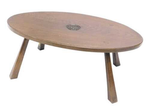A Jack Grimble of Cromer oak coffee table, of oval form, centred with a carved tudor rose, on...