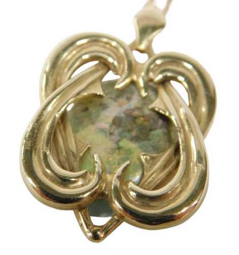 A 9ct gold mariner link necklace, 44cm long, attached to a drop pendant with large oval stone,...