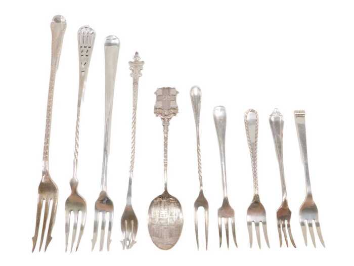 Ten various silver pickle forks and other serving items, to include a three pronged Old English...