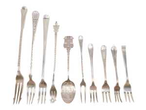 Ten various silver pickle forks and other serving items, to include a three pronged Old English...