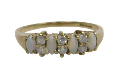 A 9ct gold opal and CZ dress ring, set with four marquis cut opals and six white stones, each...