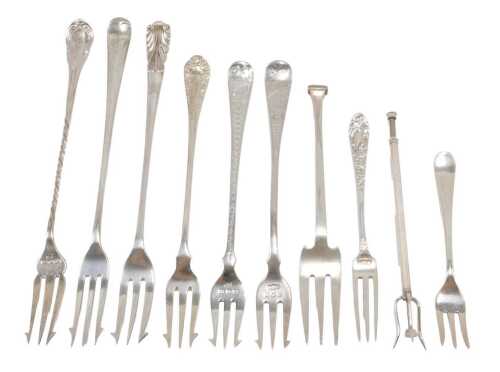 Ten pickle forks, to include a three pronged example with bright cut Old English pattern stem,...